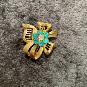 Vintage Harry Iskin Gold filled Brooch. Gold with aqua marine and white stones